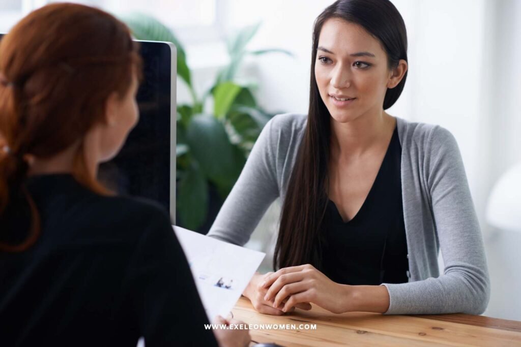 When to Tell Your Employer About Pregnancy. Pregnant woman talking to her manager in a private office meeting